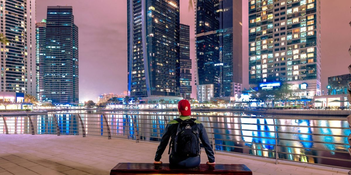 An investor thoughtfully reviews opportunities in Dubai, a city poised for significant growth under the 2040 Urban Master Plan.