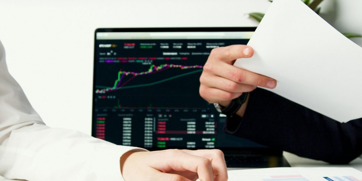 Professionals analyze market data, reflecting the steady price growth and varied rental yields in Dubai's real estate.
