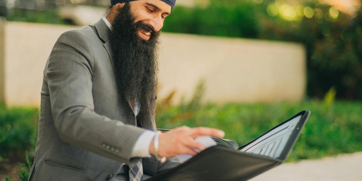 A person confidently reviewing an investment portfolio, reflecting the importance of developer brand in property value.