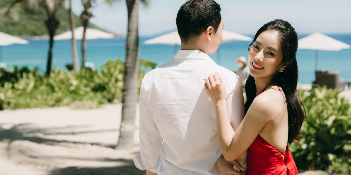 A couple relaxing in a luxurious, tranquil beach setting, embodying the Palm Jumeirah experience.