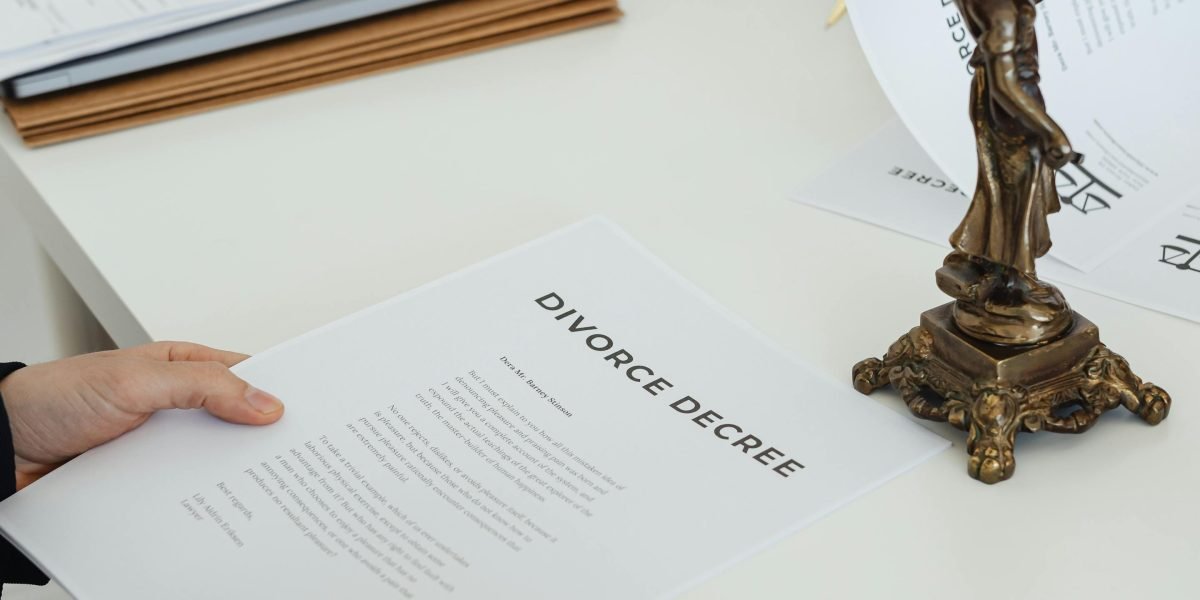 A person carefully examining legal documents, highlighting the importance of due diligence in property purchase.