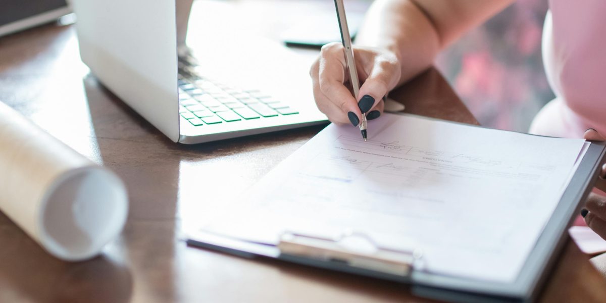 An individual thoughtfully planning their career trajectory, outlining strategic steps to achieve professional goals.