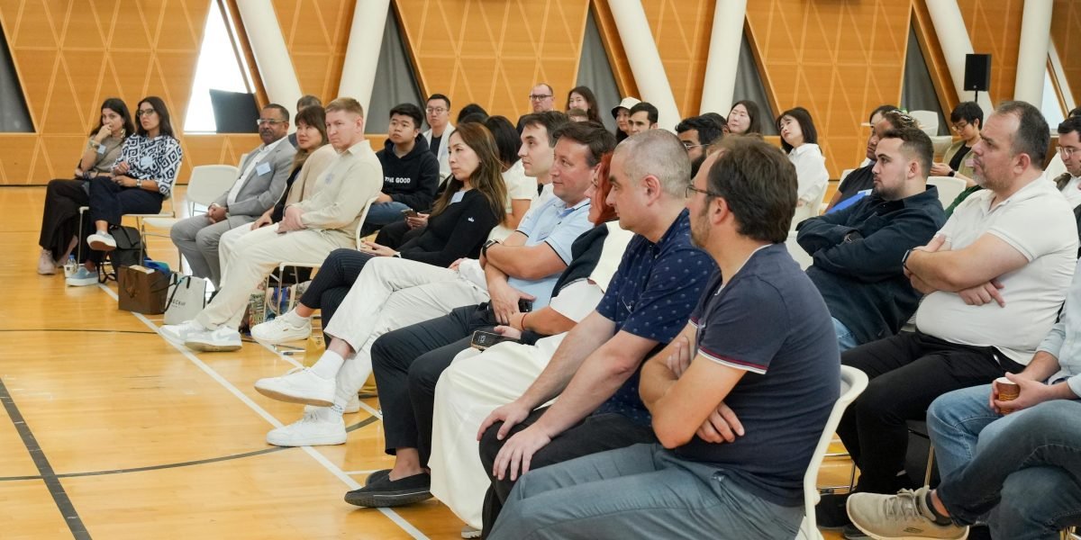 Scholars engaging in a lively discussion at an academic event, fostering professional connections and collaboration.