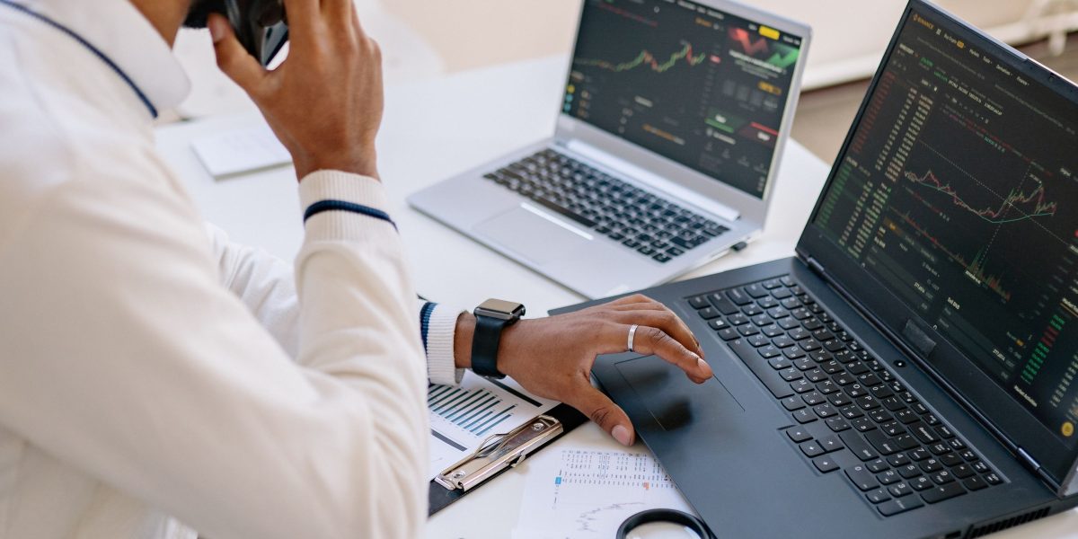 An individual thoughtfully analyzing data, representing the strategic research needed for successful property investment.