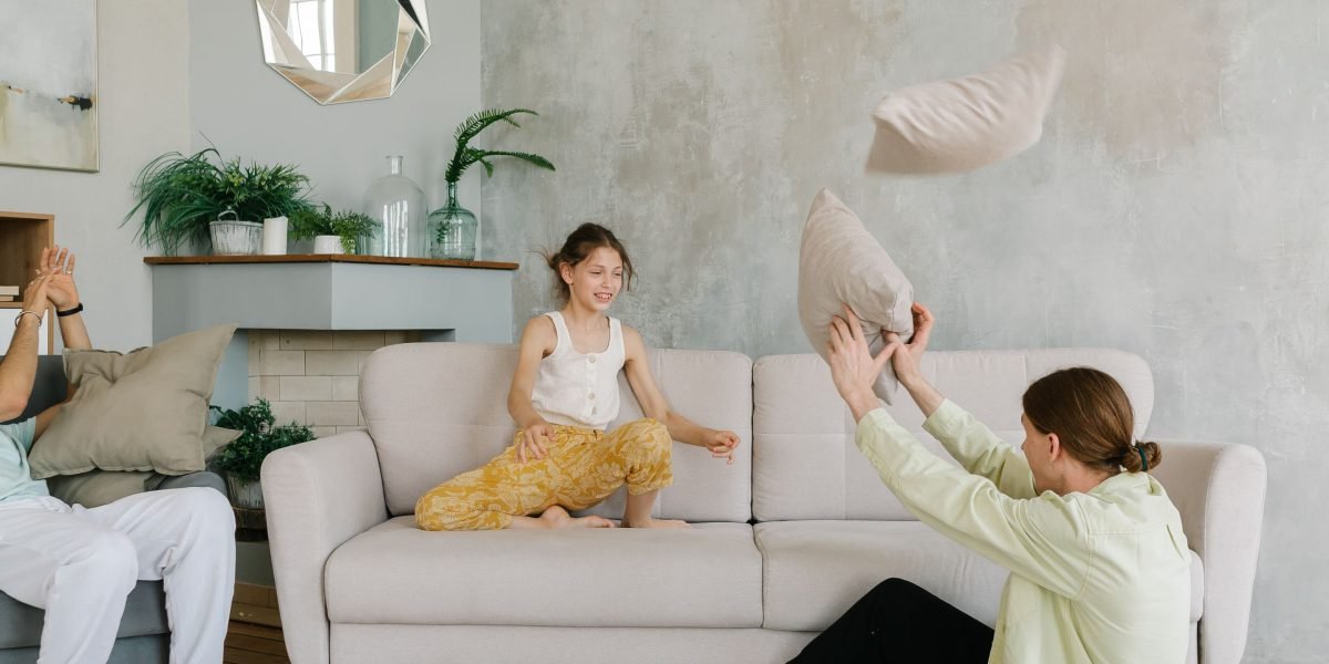 A family enjoying a luxurious home with a beautiful view, embodying the aspirational lifestyle of high-end property.