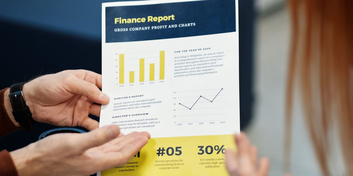 Professionals discussing financial reports, emphasizing the importance of detailed analysis in real estate investment.