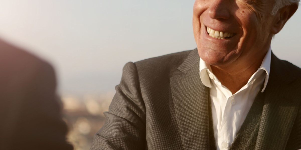 A person expressing relief and happiness after successfully navigating a complex process, like a property purchase.