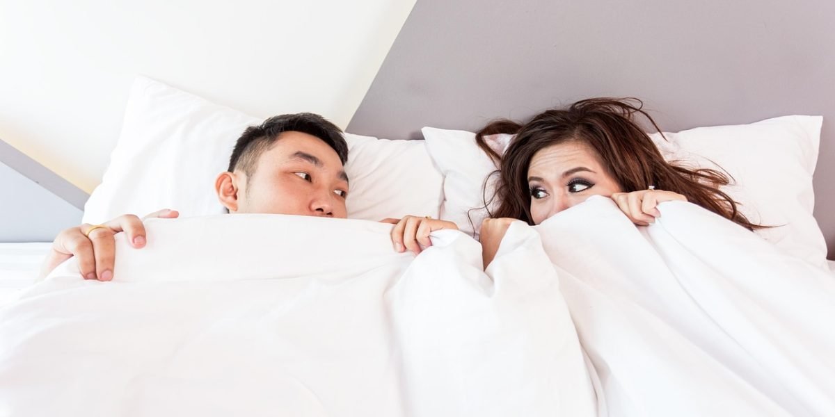 A couple carefully inspecting the interior of a potential rental home, a crucial step in the renting process.