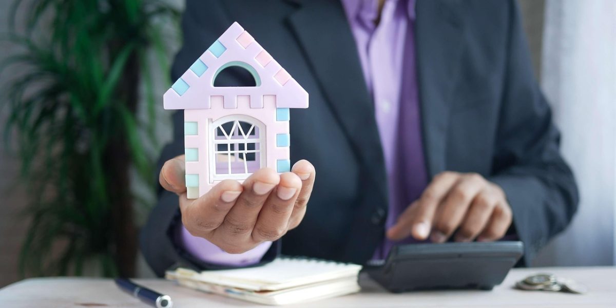 A person thoughtfully planning their ideal property purchase, considering location, size, and essential features.