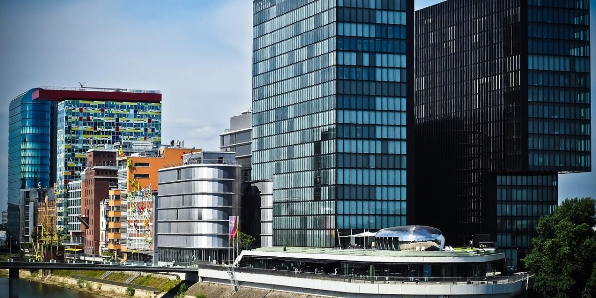 A person confidently looking at a modern city skyline, symbolizing aspirations in a booming luxury market.