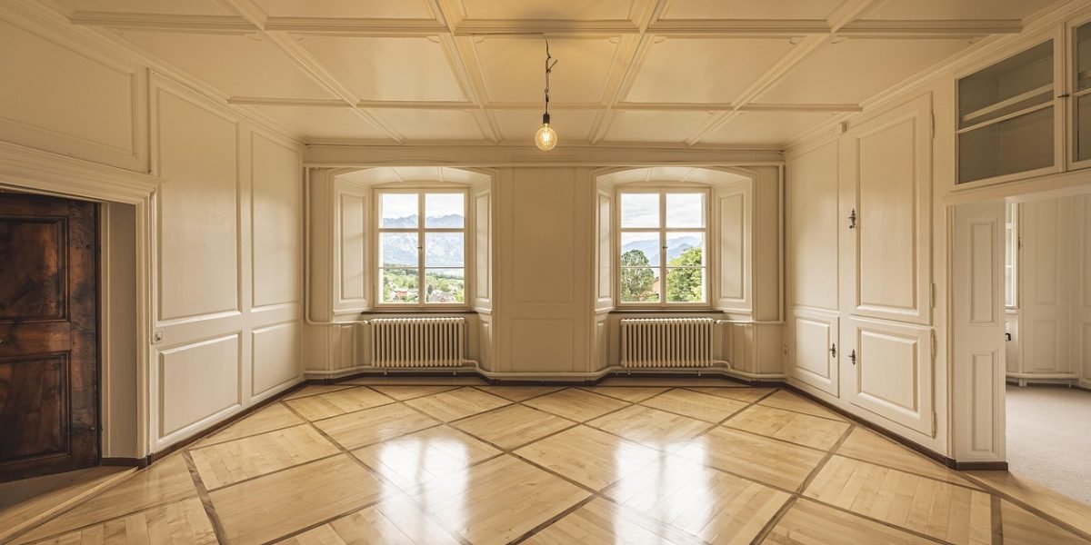 A luxury real estate agent showing property details to a client, emphasizing personalized guidance and expertise.
