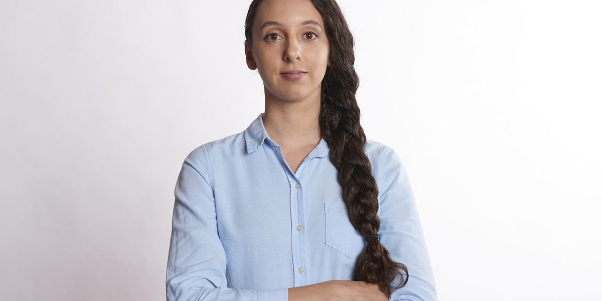 A person exhibiting confidence and satisfaction, symbolizing the peace of mind from a reliable property choice.