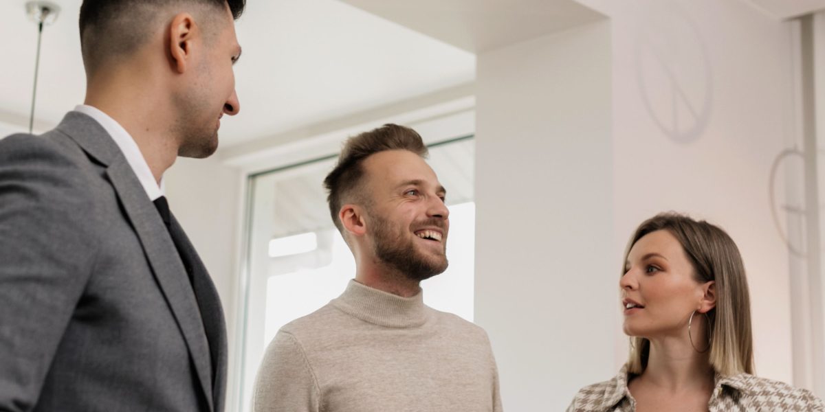 A confident person engaging in a professional discussion about property investment.