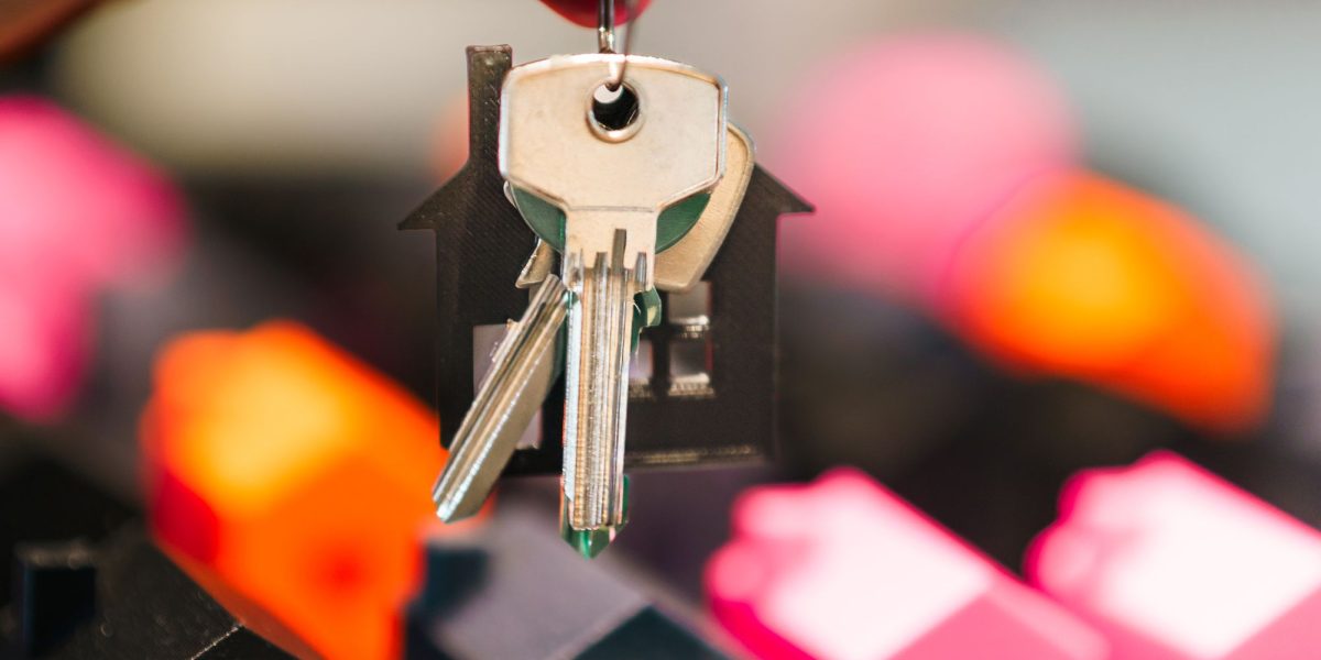 A person thoughtfully considering various luxury property choices with market insights.