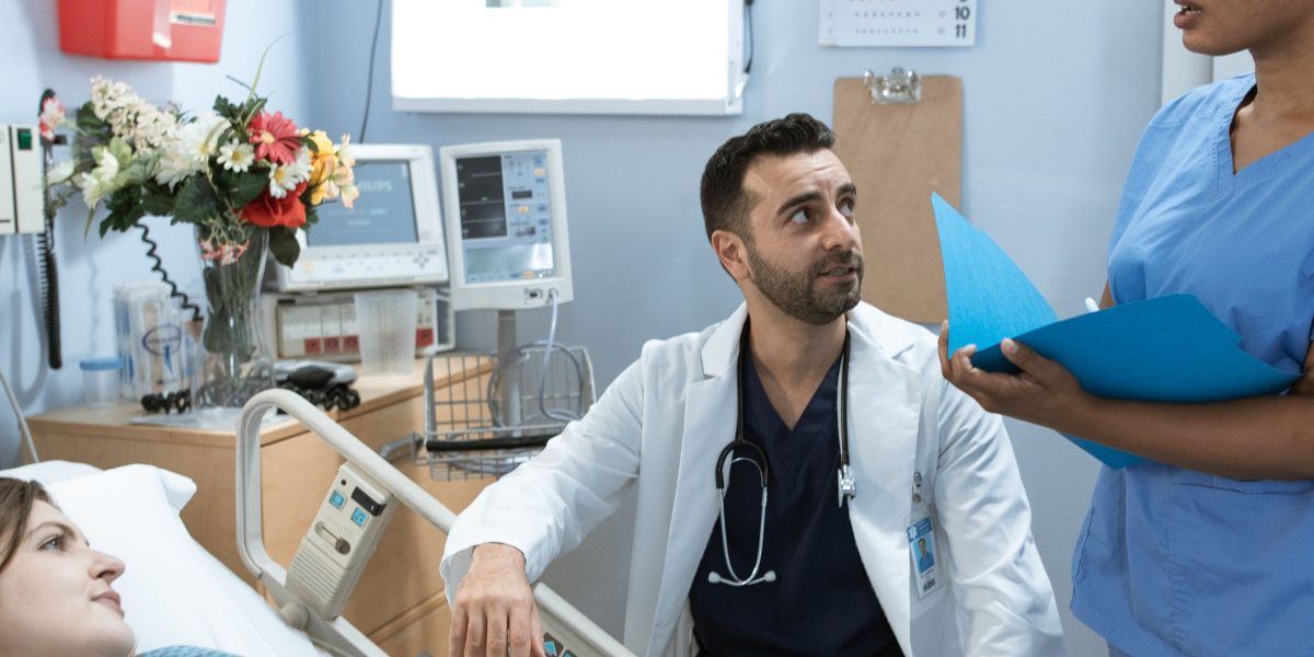 A medical team collaborates in a hospital setting, reflecting diverse work environments for physiotherapists.