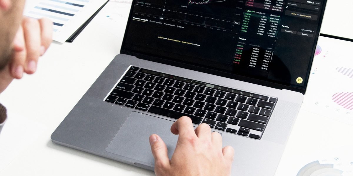 A professional evaluating financial reports to assess property investment potential.