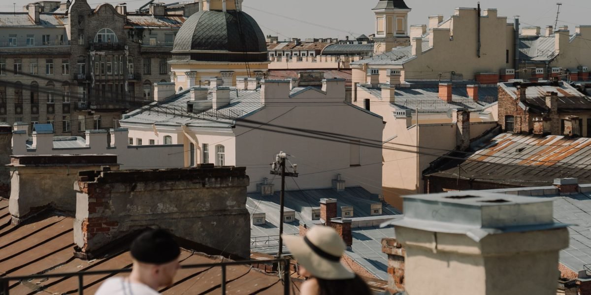 People enjoying the panoramic views from a high-rise luxury residence, representing an aspirational lifestyle.